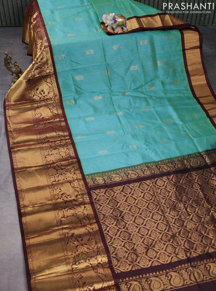 Kuppadam silk cotton saree dual shade of teal blue and deep maroon with allover zari checked pattern and long zari woven border