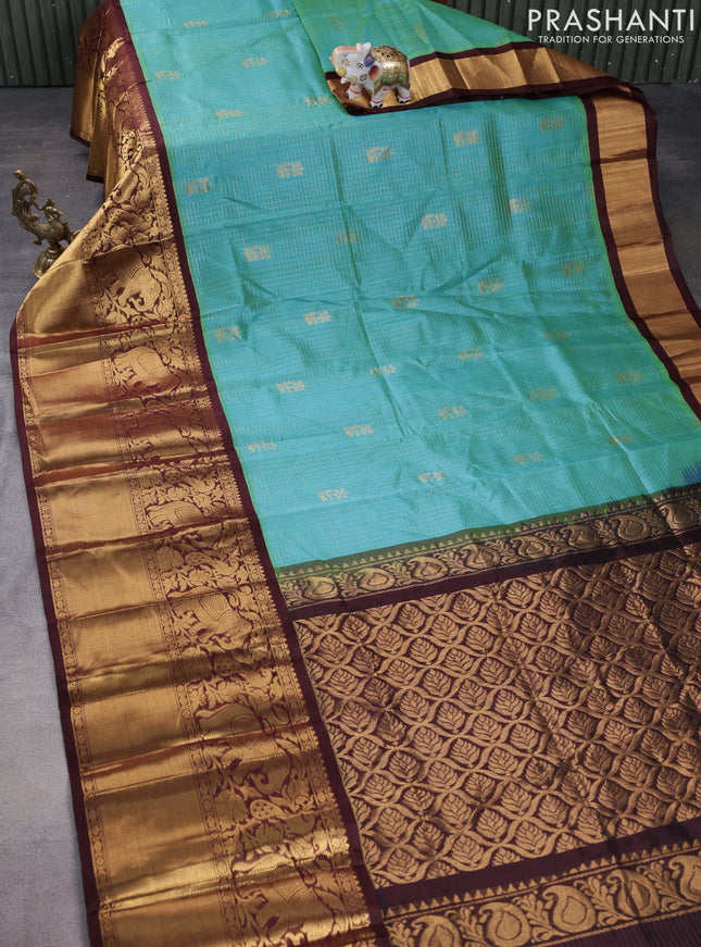 Kuppadam silk cotton saree dual shade of teal blue and deep maroon with allover zari checked pattern and long zari woven border