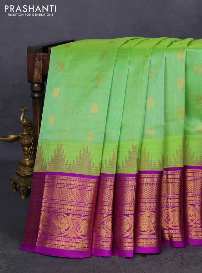 Kuppadam silk cotton saree light green and purple with zari woven buttas and temple design zari woven border