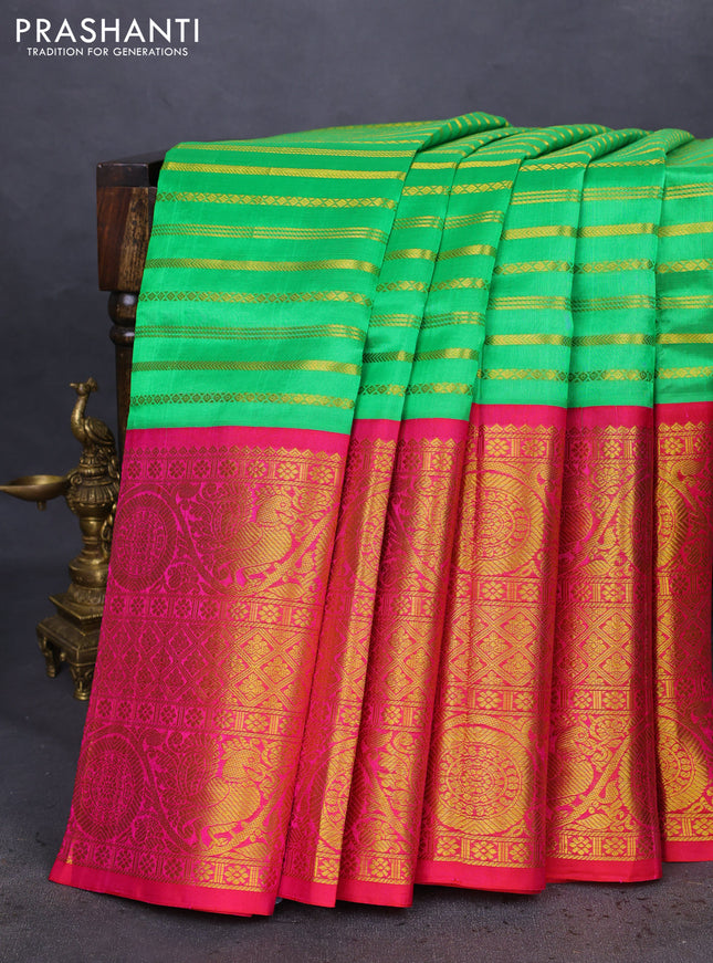Kuppadam silk cotton saree green and pink with allover zari stripes pattern and long zari woven border