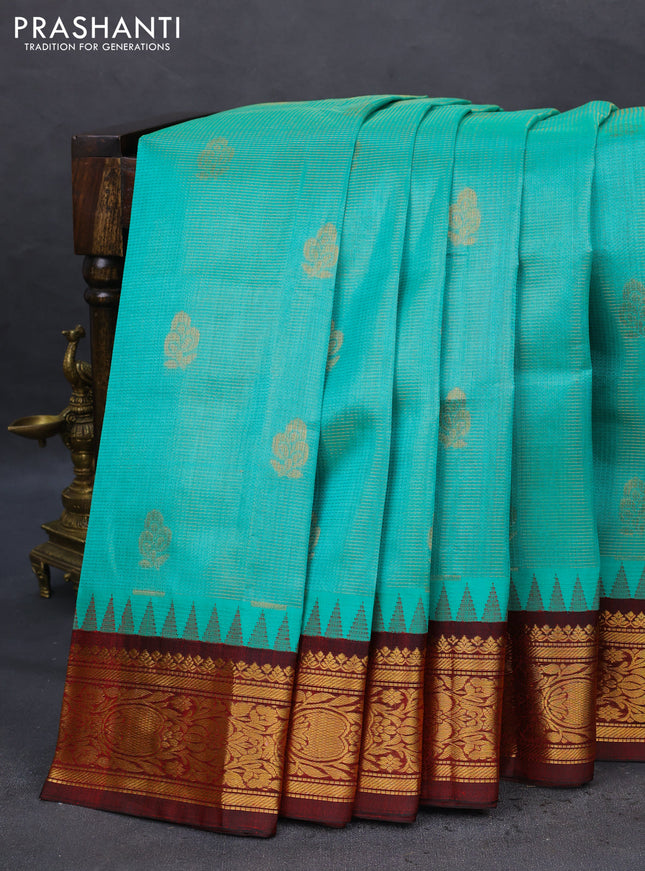 Kuppadam silk cotton saree teal green and deep maroon with allover vairosi pattern & buttas and temple design zari woven border