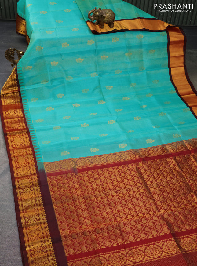 Kuppadam silk cotton saree teal green and deep maroon with allover vairosi pattern & buttas and temple design zari woven border