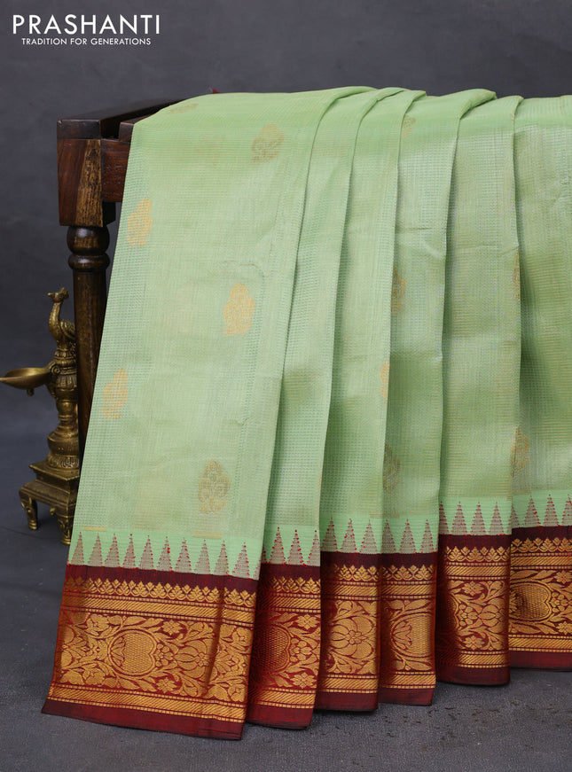 Kuppadam silk cotton saree pista green and deep maroon with allover vairosi pattern & buttas and temple design zari woven border
