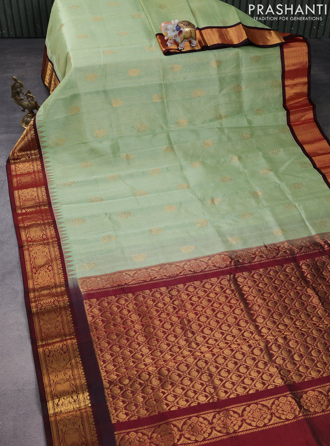 Kuppadam silk cotton saree pista green and deep maroon with allover vairosi pattern & buttas and temple design zari woven border