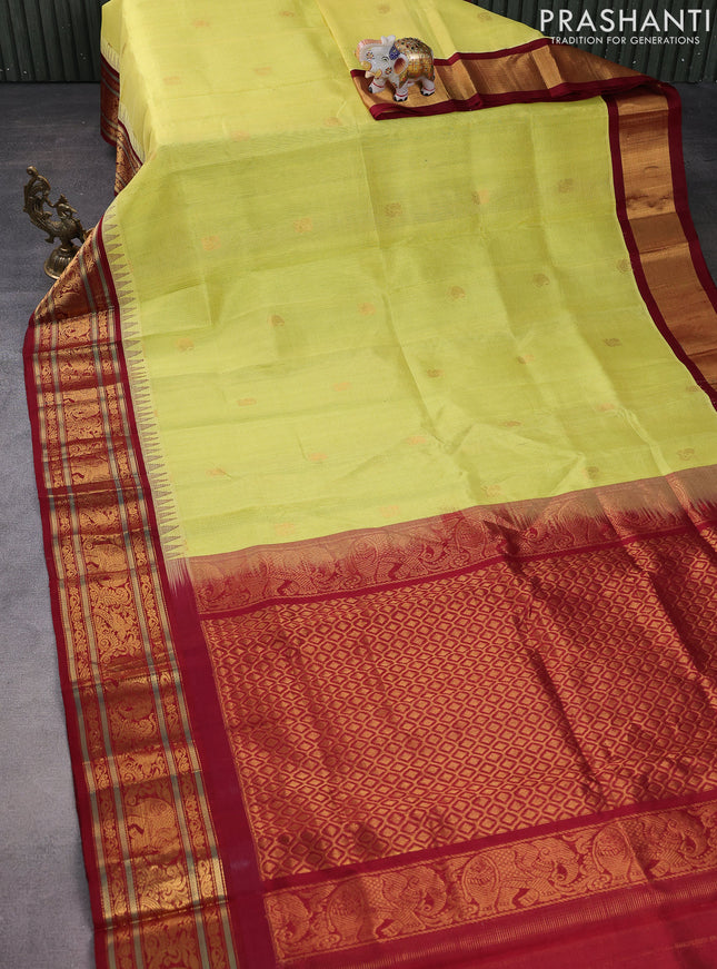 Kuppadam silk cotton saree yellow and maroon with allover vairosi pattern & buttas and temple design zari woven border