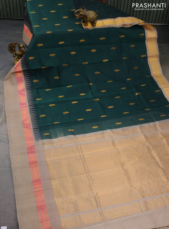 Kuppadam silk cotton saree bottle green and grey shade with zari woven buttas and temple design zari woven border