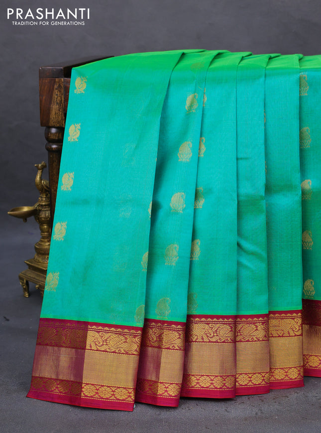 Kuppadam silk cotton saree dual shade of teal bluish green and purple with zari woven buttas and zari woven border