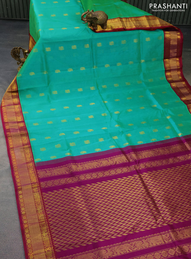 Kuppadam silk cotton saree dual shade of teal bluish green and purple with zari woven buttas and zari woven border