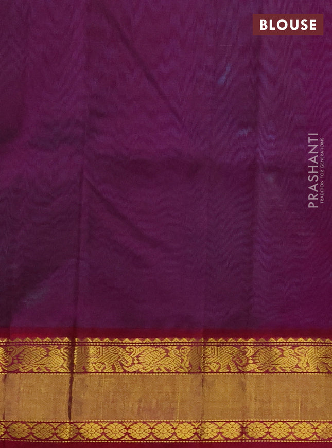 Kuppadam silk cotton saree dual shade of teal bluish green and purple with zari woven buttas and zari woven border