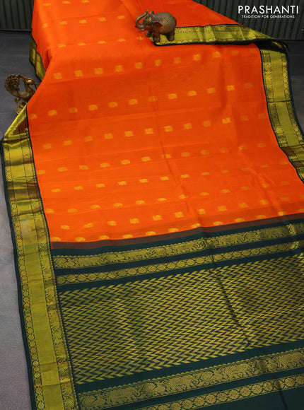 Kuppadam silk cotton saree orange and bottle green with zari woven paisley buttas and zari woven border