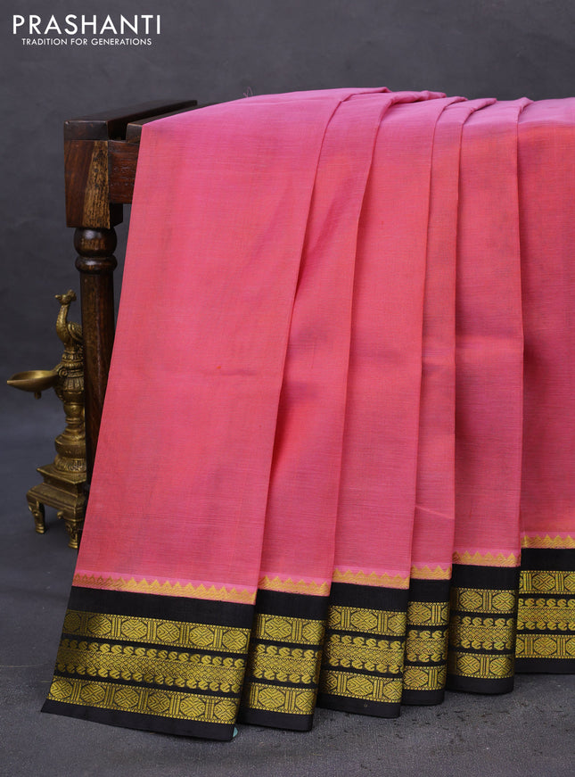 Kuppadam silk cotton saree peach pink and black with plain body and zari woven border