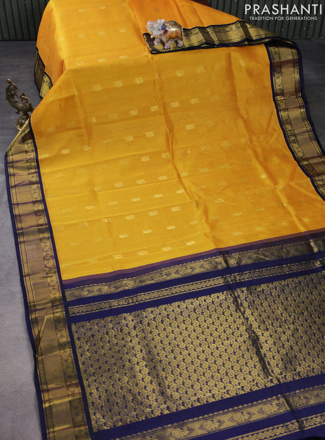 Kuppadam silk cotton saree mango yellow and navy blue with annam zari woven buttas and zari woven border