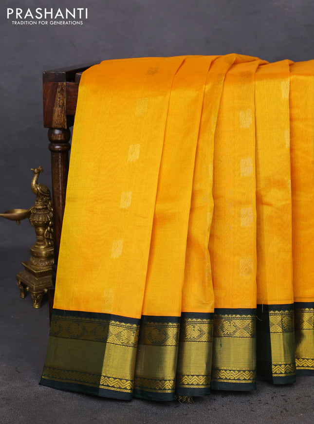Kuppadam silk cotton saree yellow and bottle green with annam zari woven buttas and zari woven border