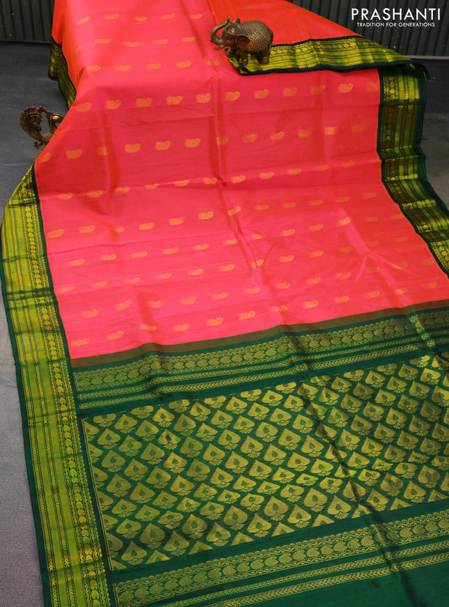 Kuppadam silk cotton saree peach pink and dark green with zari woven paisley buttas and zari woven border