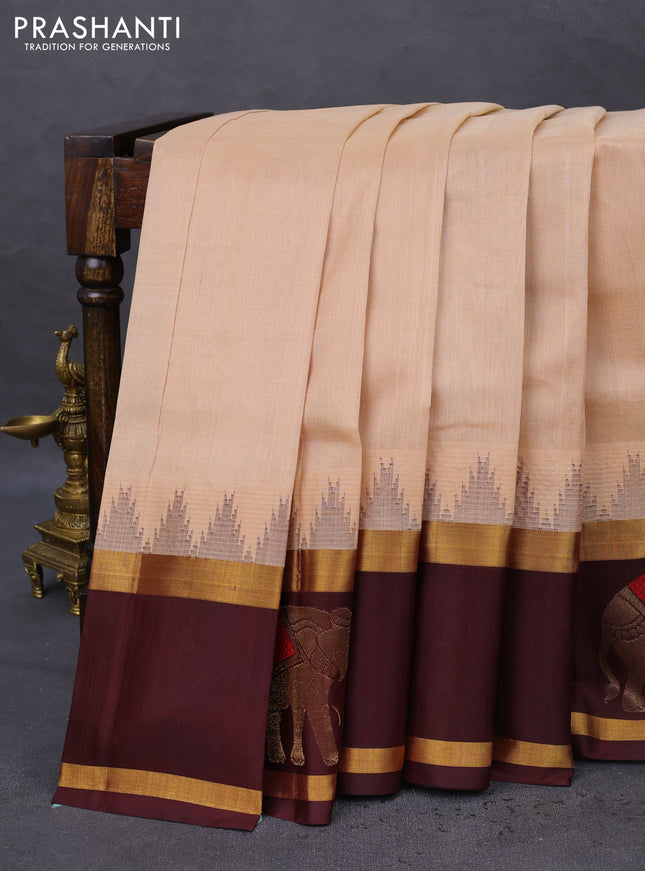 Kuppadam silk cotton saree sandal and deep maroon with plain body and temple design zari woven butta border