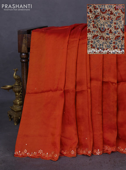 Satin crepe silk saree orange and beige with mirror work and ajrakh printed blouse