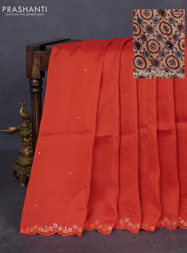 Satin crepe silk saree orange and beige with mirror work and ajrakh printed blouse