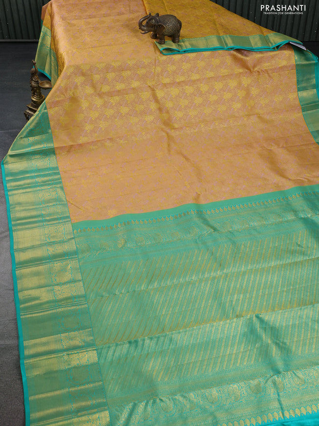 Pure kanchipuram silk saree sandal and teal green with allover zari woven brocade weaves and zari woven border