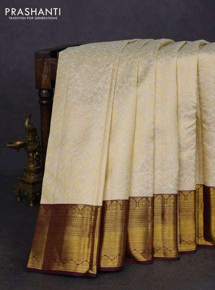Pure kanchipuram silk saree cream and deep wine shade with allover zari woven brocade weaves and zari woven border