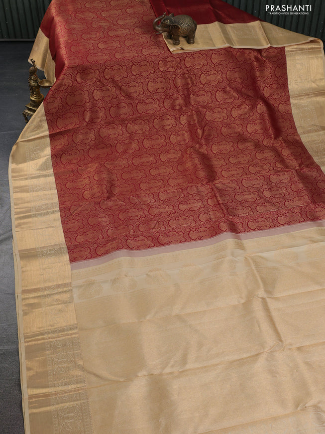 Pure kanchipuram silk saree maroon and sandal with allover zari woven brocade weaves and zari woven border