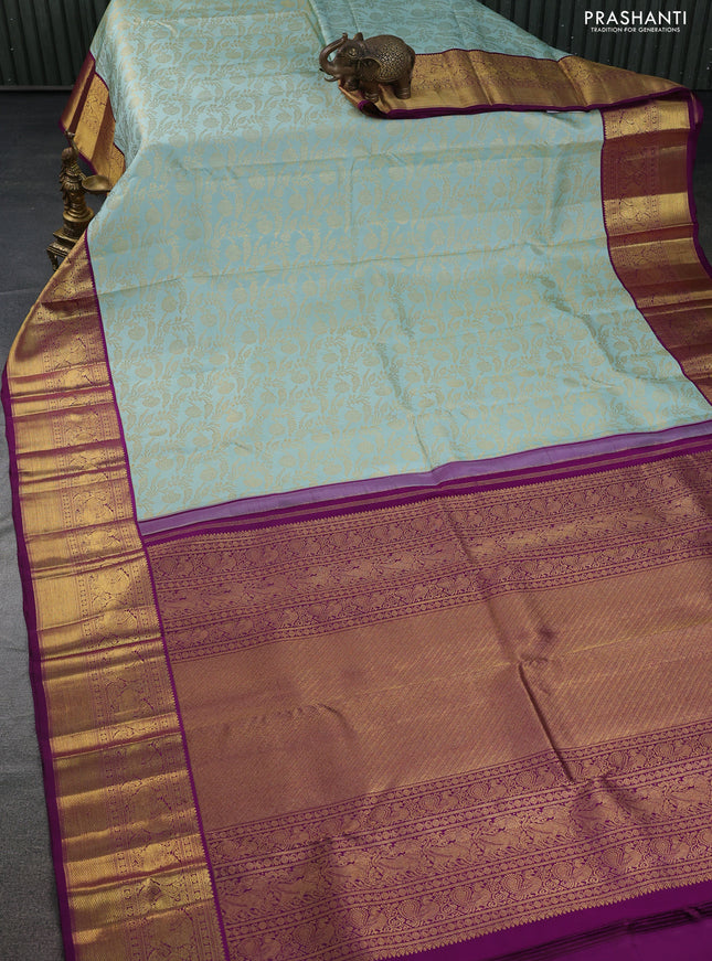 Pure kanchipuram silk saree pastel blue and purple with allover zari woven brocade weaves and zari woven border