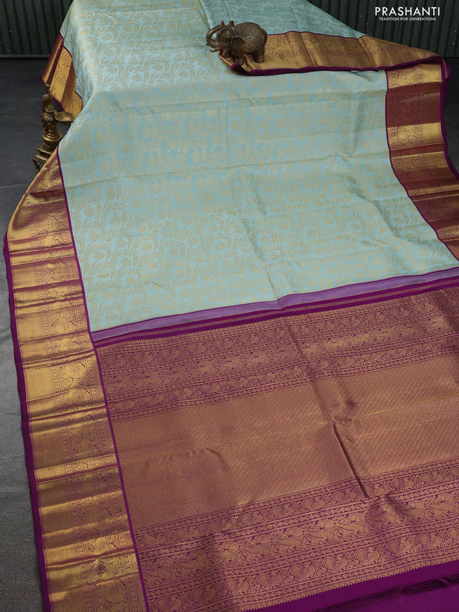 Pure kanchipuram silk saree pastel blue and purple with allover zari woven brocade weaves and zari woven border