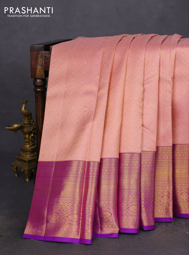 Pure kanchipuram silk saree peach shade and purple with allover zari woven brocade weaves and zari woven border