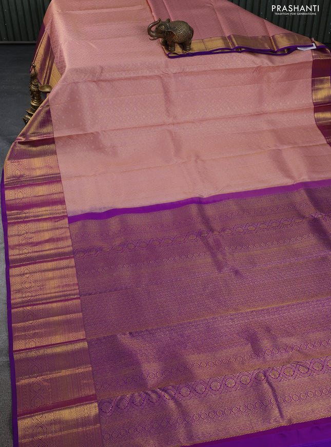Pure kanchipuram silk saree peach shade and purple with allover zari woven brocade weaves and zari woven border