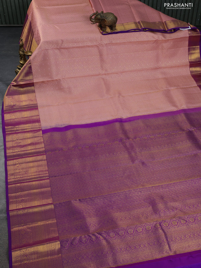 Pure kanchipuram silk saree peach shade and purple with allover zari woven brocade weaves and zari woven border