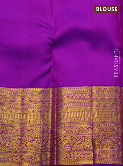 Pure kanchipuram silk saree peach shade and purple with allover zari woven brocade weaves and zari woven border