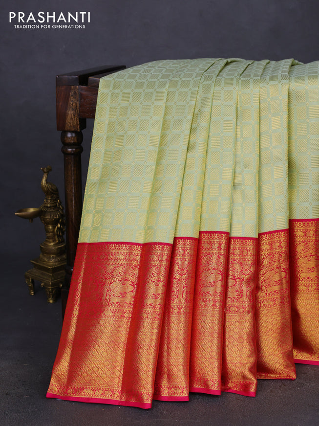Pure kanchipuram silk saree pista green and pink with allover zari woven brocade weaves and long zari woven border