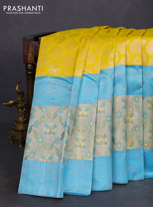 Pure kanchipuram silk saree yellow and teal blue with silver zari woven buttas and long rich zari woven border