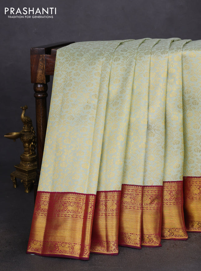 Pure kanchipuram silk saree pastel green and dark magenta pink with allover zari woven brocade weaves and zari woven border
