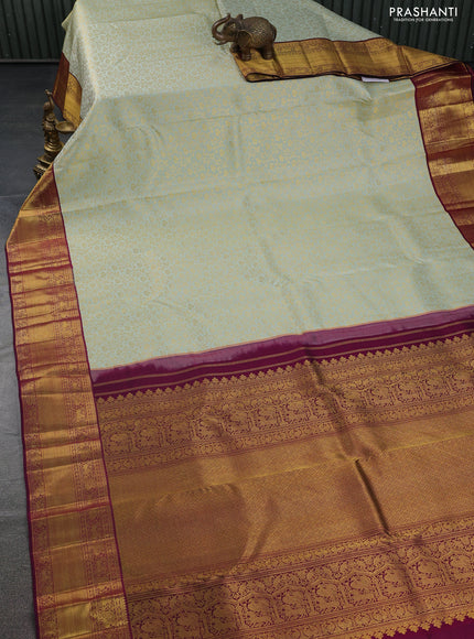 Pure kanchipuram silk saree pastel green and dark magenta pink with allover zari woven brocade weaves and zari woven border
