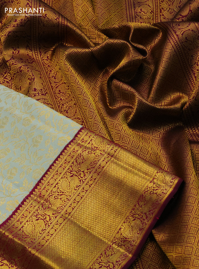 Pure kanchipuram silk saree pastel green and dark magenta pink with allover zari woven brocade weaves and zari woven border