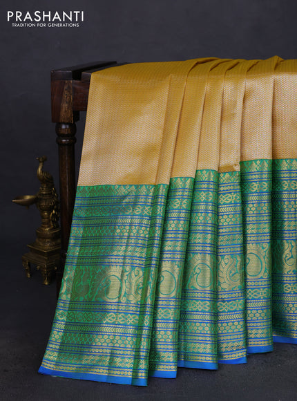 Pure kanchipuram silk saree yellow and blue with allover silver zari woven brocade weaves and long zari woven border