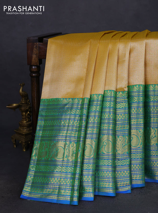 Pure kanchipuram silk saree yellow and blue with allover silver zari woven brocade weaves and long zari woven border