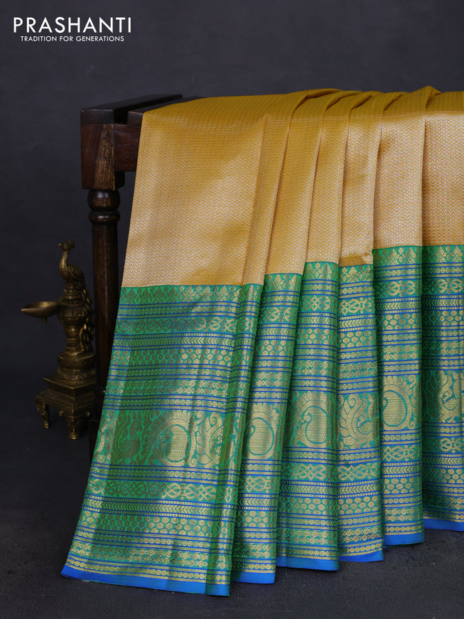 Pure kanchipuram silk saree yellow and blue with allover silver zari woven brocade weaves and long zari woven border