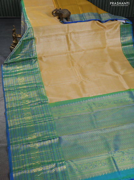 Pure kanchipuram silk saree yellow and blue with allover silver zari woven brocade weaves and long zari woven border