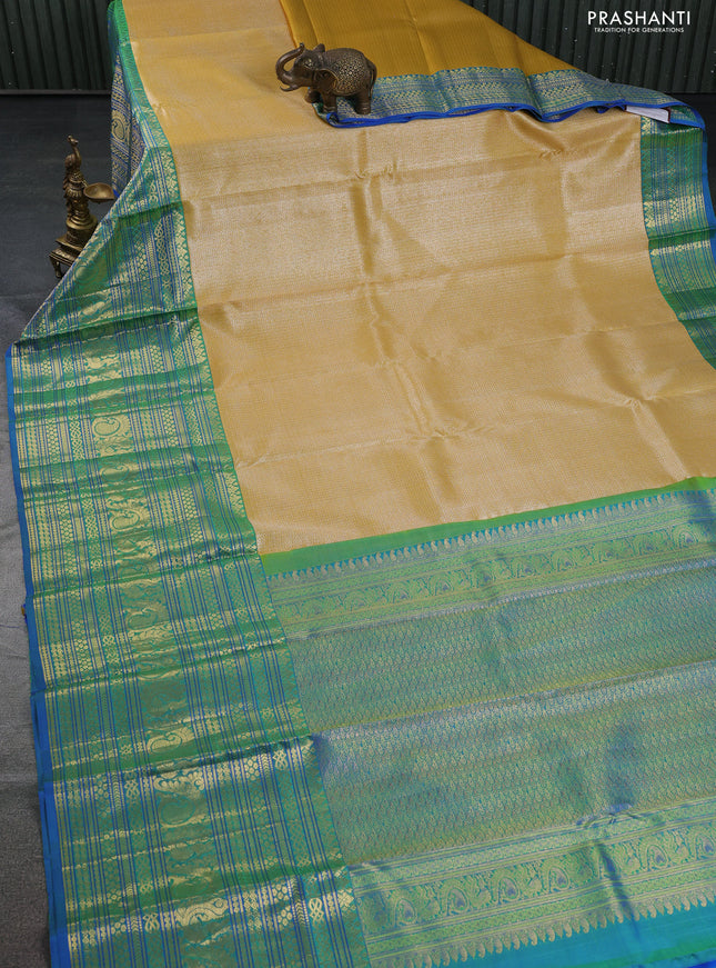 Pure kanchipuram silk saree yellow and blue with allover silver zari woven brocade weaves and long zari woven border