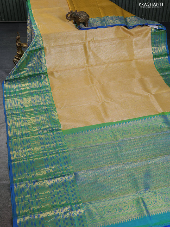 Pure kanchipuram silk saree yellow and blue with allover silver zari woven brocade weaves and long zari woven border