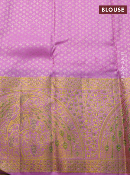 Pure kanchipuram silk saree deep purple and lotus pink with allover zari woven brocade weaves and long rich zari woven border