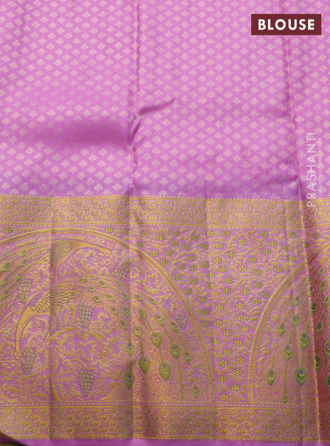Pure kanchipuram silk saree deep purple and lotus pink with allover zari woven brocade weaves and long rich zari woven border