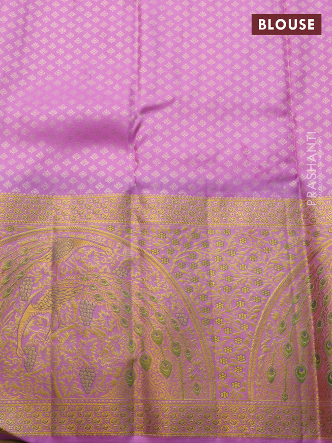 Pure kanchipuram silk saree deep purple and lotus pink with allover zari woven brocade weaves and long rich zari woven border