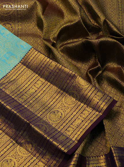 Pure kanchipuram silk saree teal blue and deep jamun with allover zari woven brocade weaves and long zari woven border