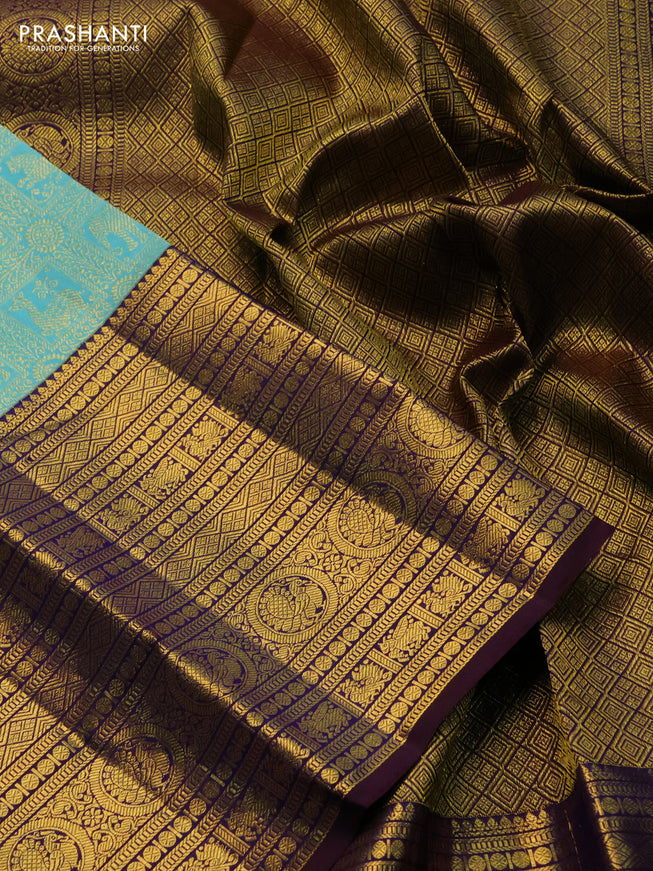 Pure kanchipuram silk saree teal blue and deep jamun with allover zari woven brocade weaves and long zari woven border