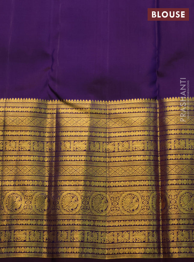 Pure kanchipuram silk saree teal blue and deep jamun with allover zari woven brocade weaves and long zari woven border