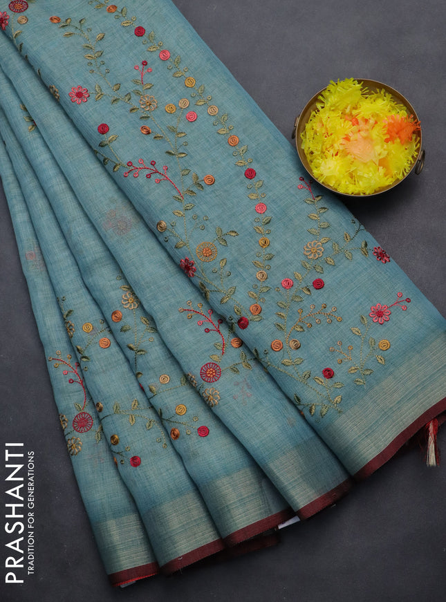 linen cotton saree pastel blue and maroon with embroidery buttas and zari woven border