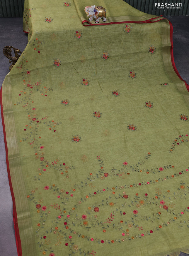 linen cotton saree light green and red with embroidery buttas and zari woven border
