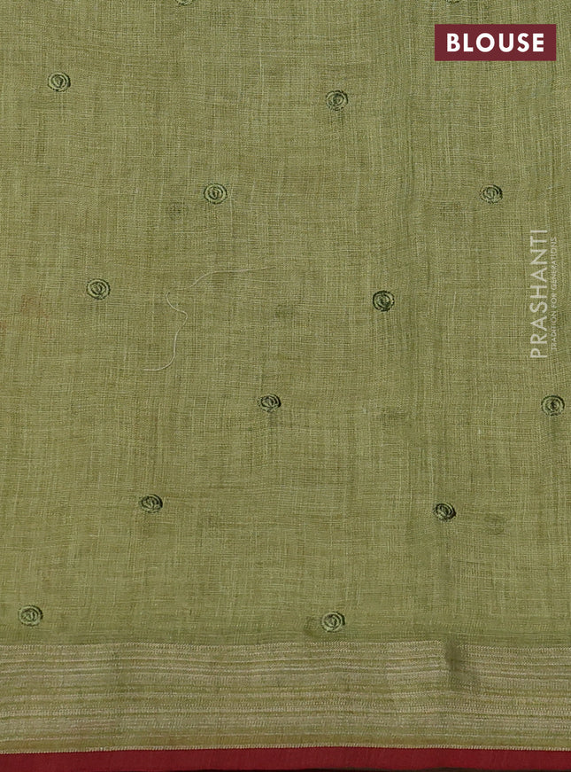 linen cotton saree light green and red with embroidery buttas and zari woven border